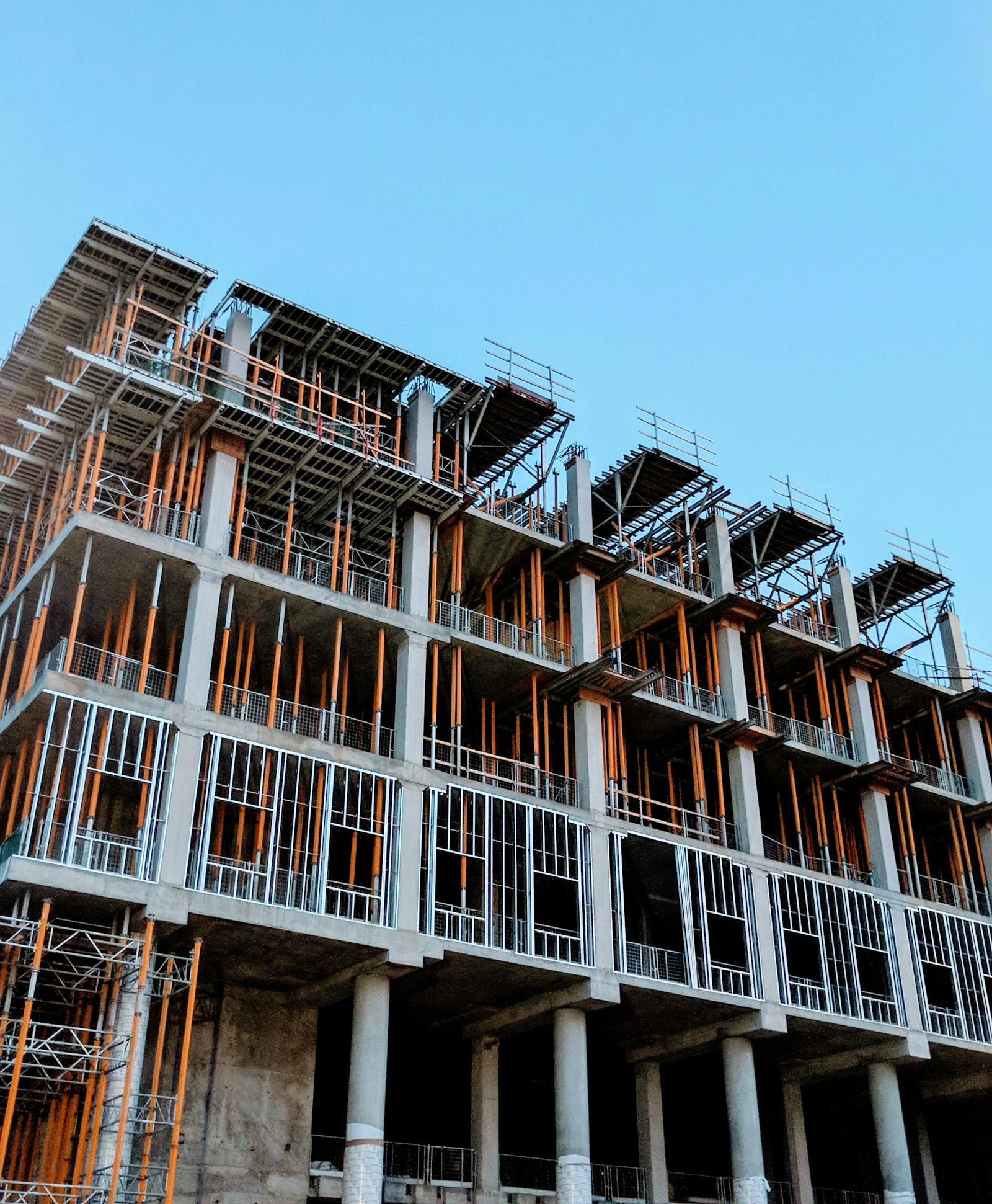 Concrete structural columns and scaffolding documentation during construction.