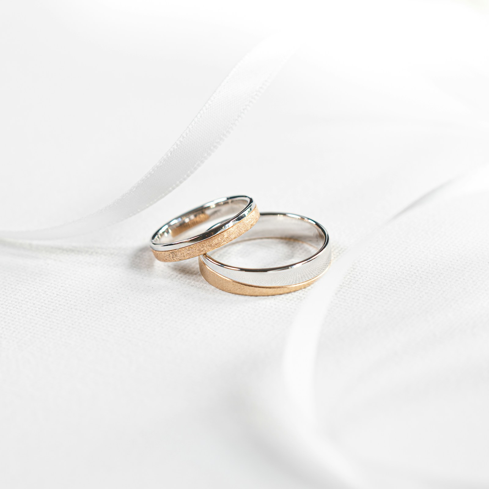 Two rings on plain cloth, photographed without ceremony — the detail before the morning starts moving.