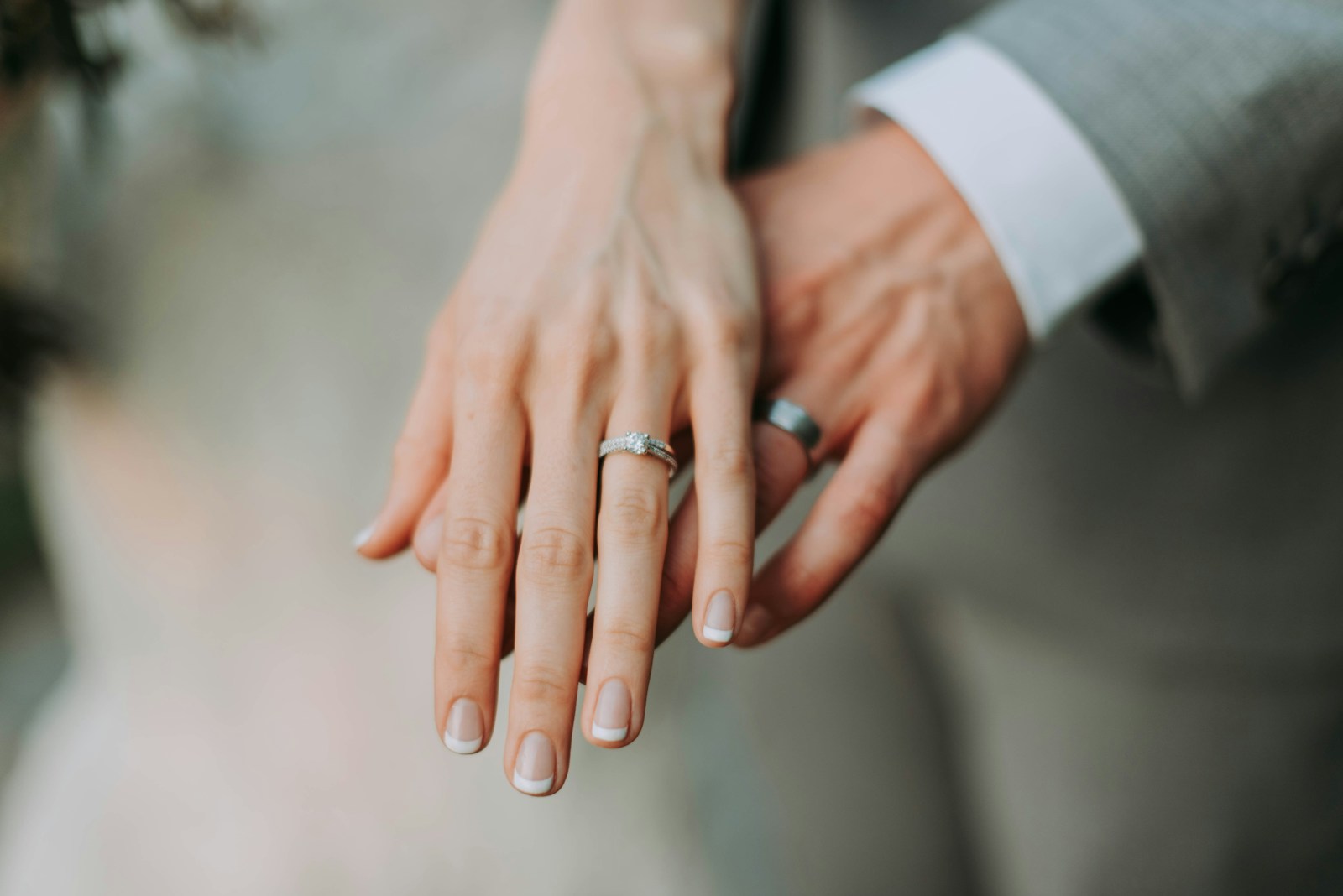 Two hands touching, the smaller gesture the day quietly turns on.