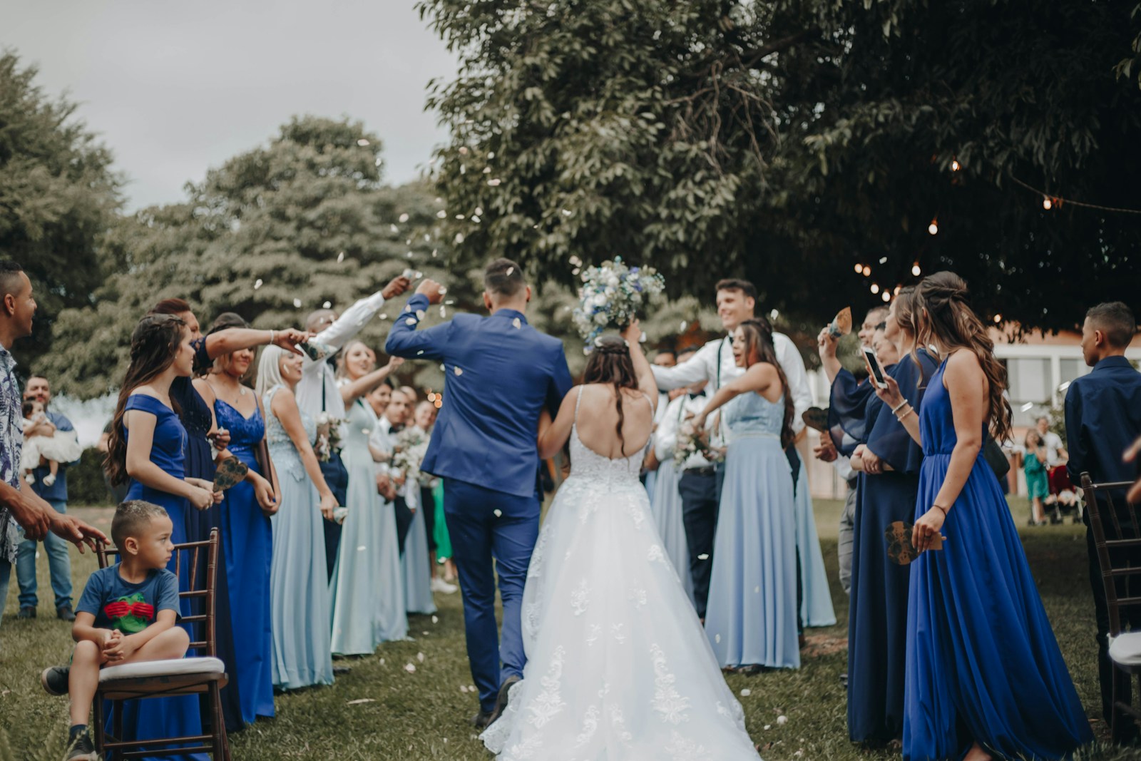 Dancing on grass at the close of a long day — guests moving without choreography.