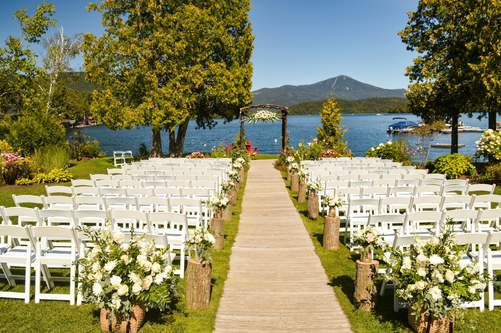 Folding chairs and a quiet line of water — an oceanside ceremony before its first guest sits down.