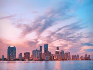 A city's high-rise buildings near a body of water.