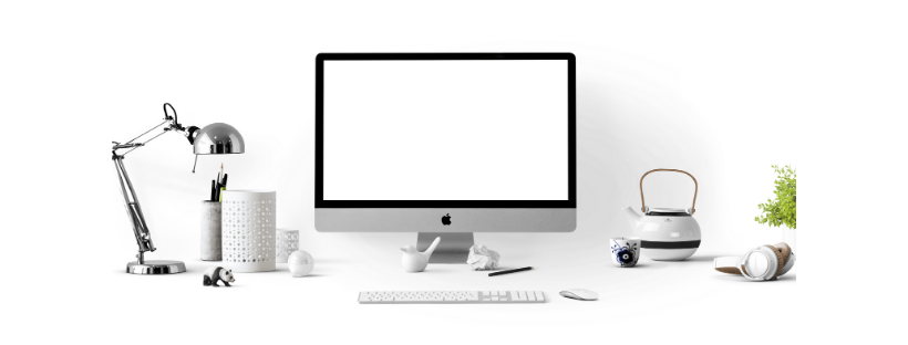 A clean desk: an iMac, tea pot, desk lamp, pen holder, and more.