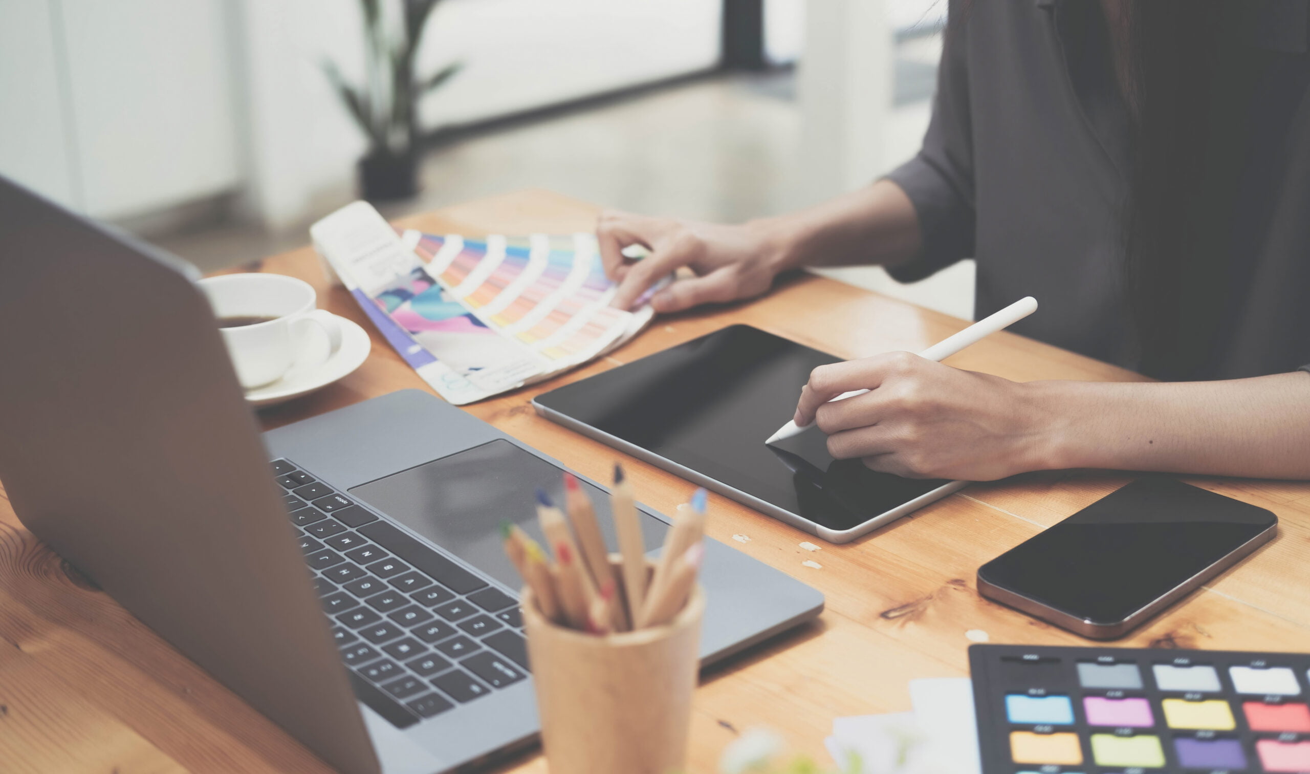 Graphic designer at work creating logos or art